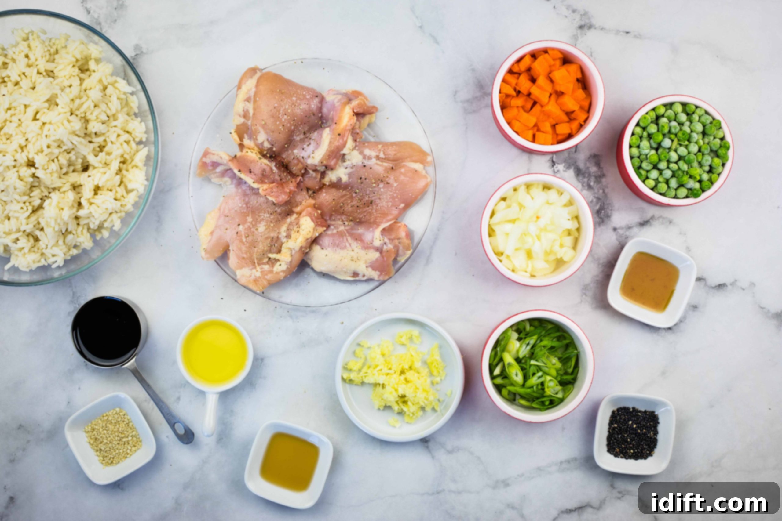 All the fresh ingredients laid out for making chicken fried rice on a Blackstone griddle.