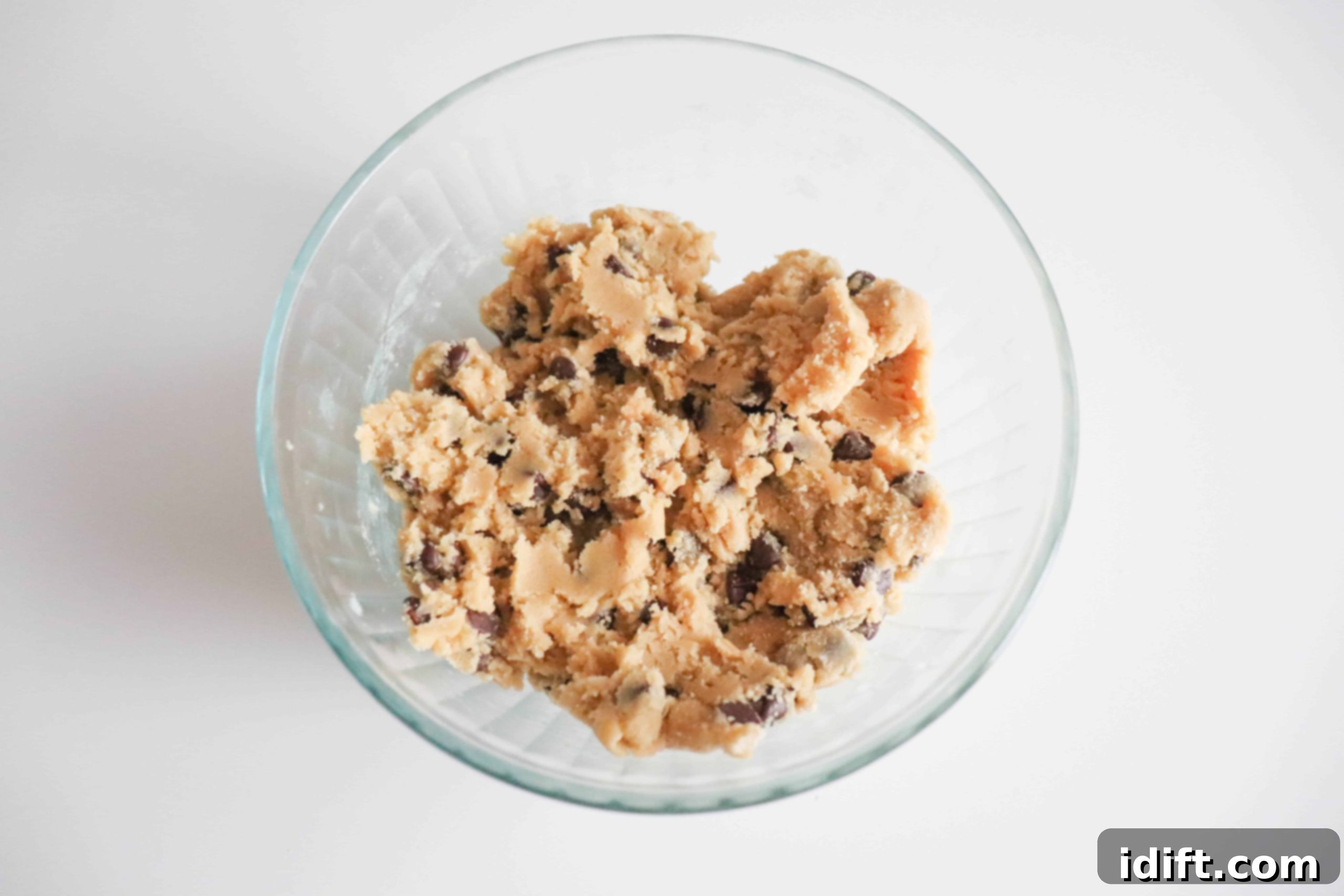 Mixed mini egg cookie batter in a bowl with a mixer
