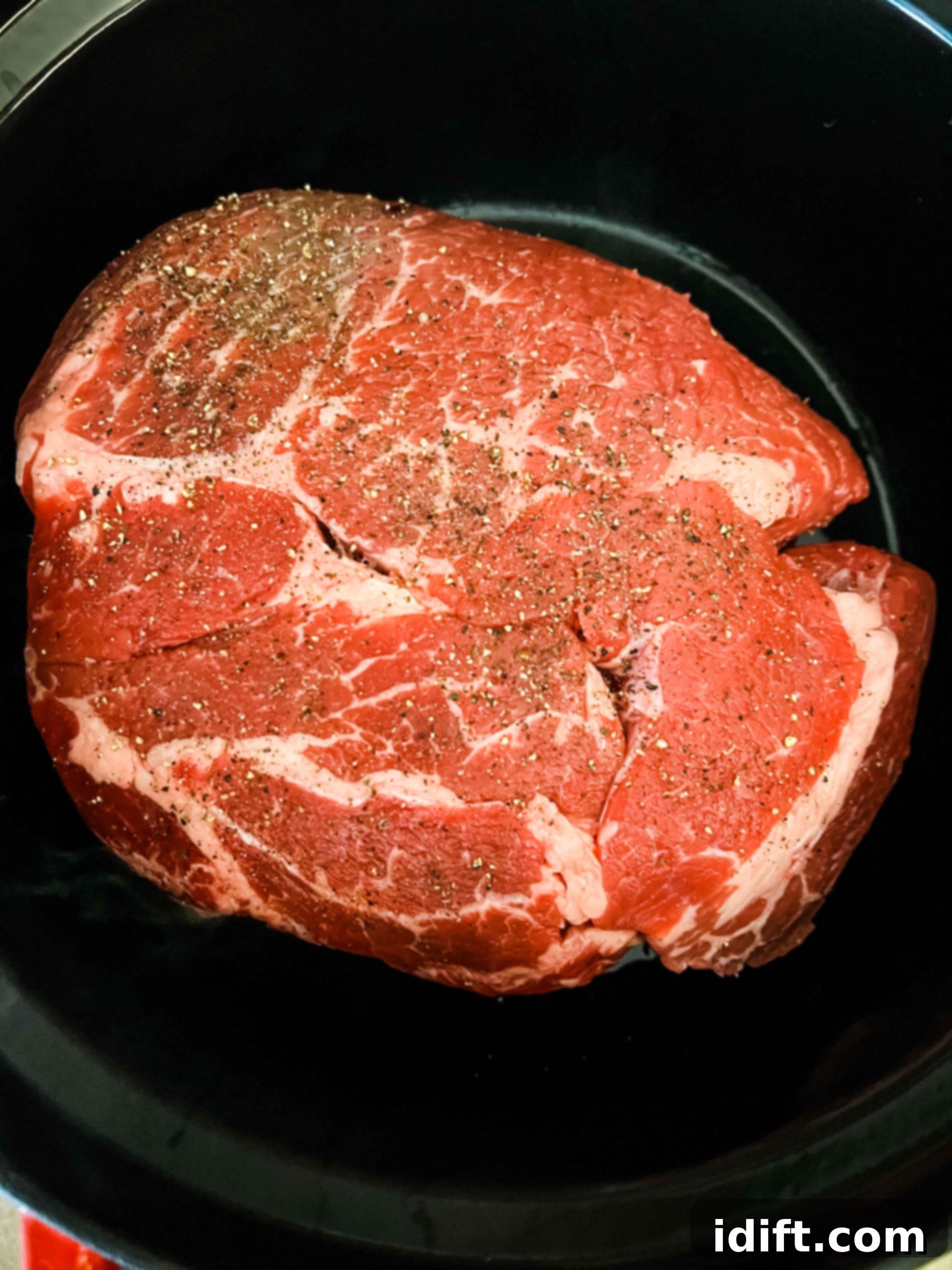 Tender Slow Cooker Birria de Res 5 Searing the beef roast in a Dutch oven until browned on all sides.