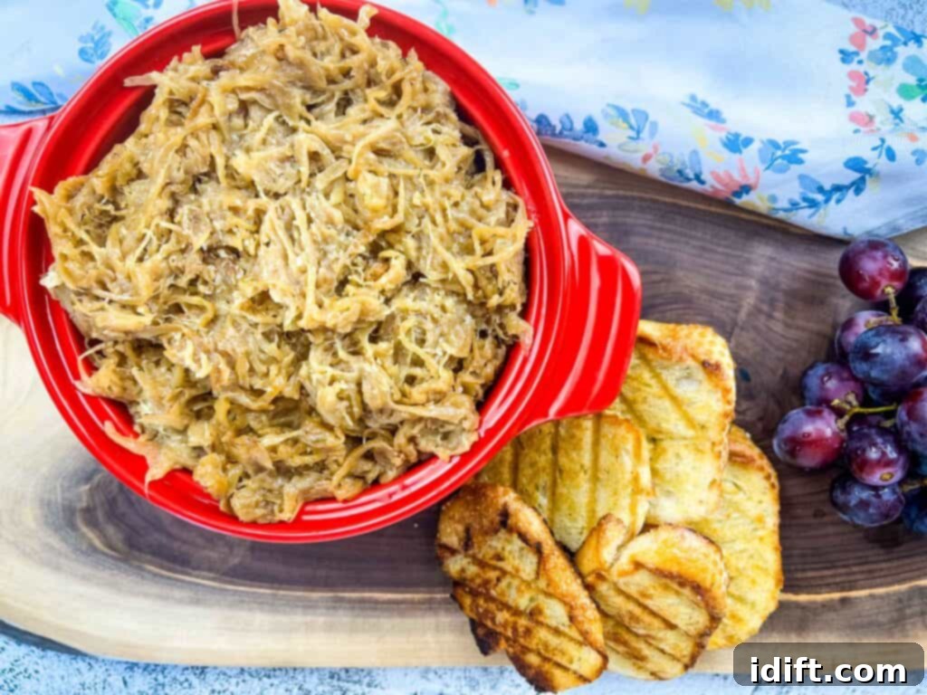 creamy caramelized onions on a platter with bread