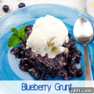 A rustic blueberry grunt served warm on a blue plate, highlighting its comforting and fruity appeal.
