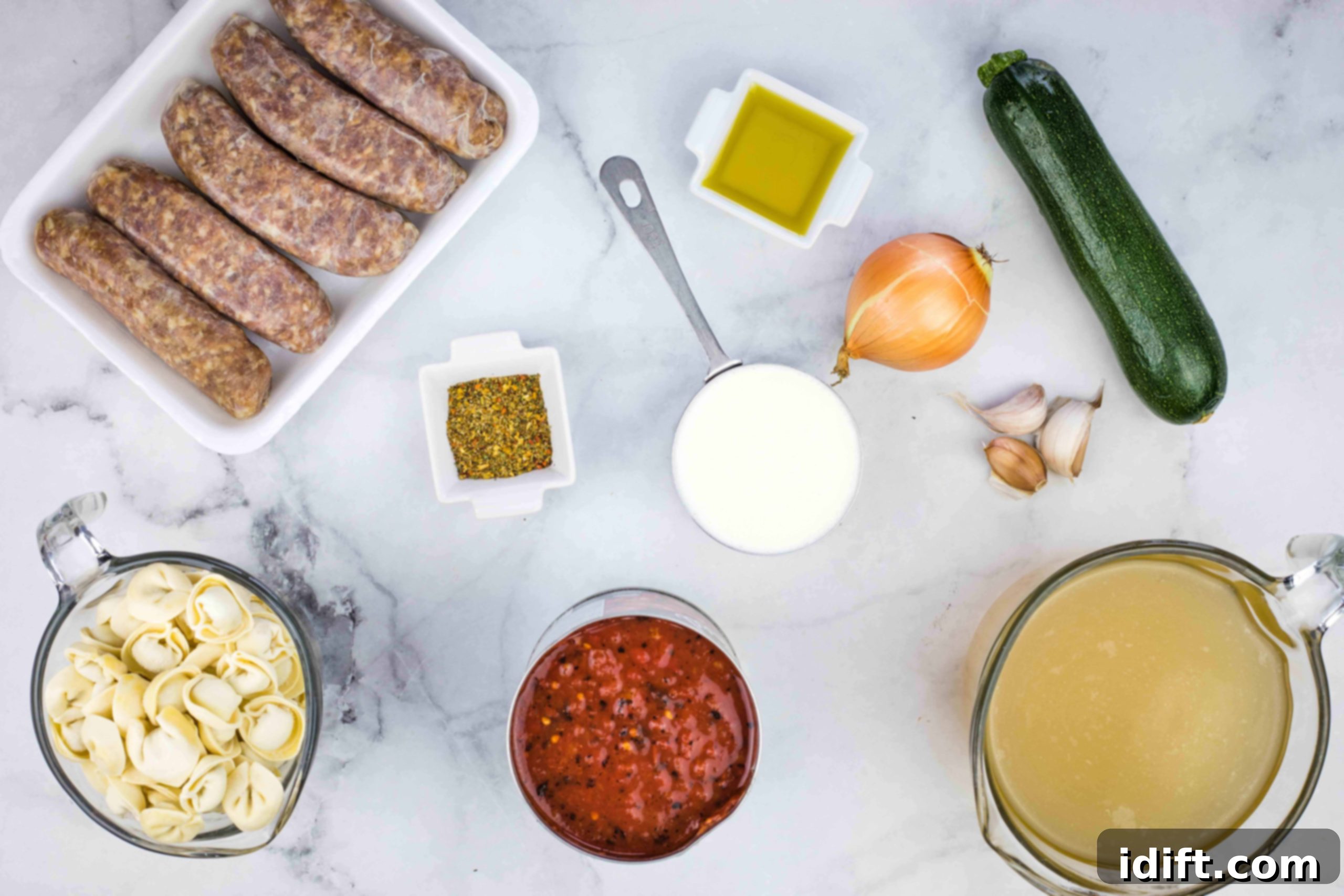 Creamy Instant Pot Sausage and Tomato Tortellini Soup 4 Ingredients laid out to make Instant Pot tortellini soup