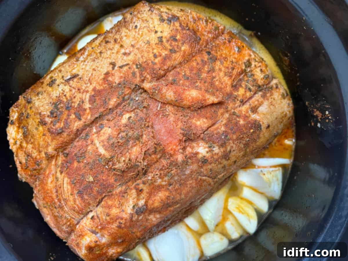 Ultimate Dutch Oven Pork Carnitas 9 pork, juices, onions, and garlic in the dutch oven