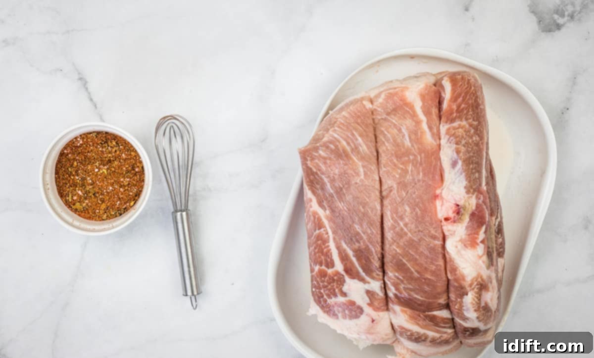 Ultimate Dutch Oven Pork Carnitas 6 the carnitas pork rub in a bowl next to the raw pork