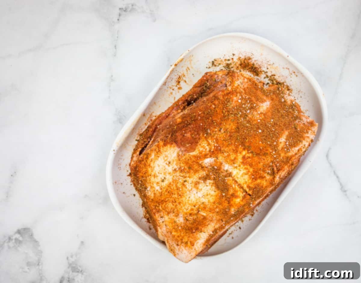 Ultimate Dutch Oven Pork Carnitas 7 pork rubbed with spice mix to make dutch oven carnitas