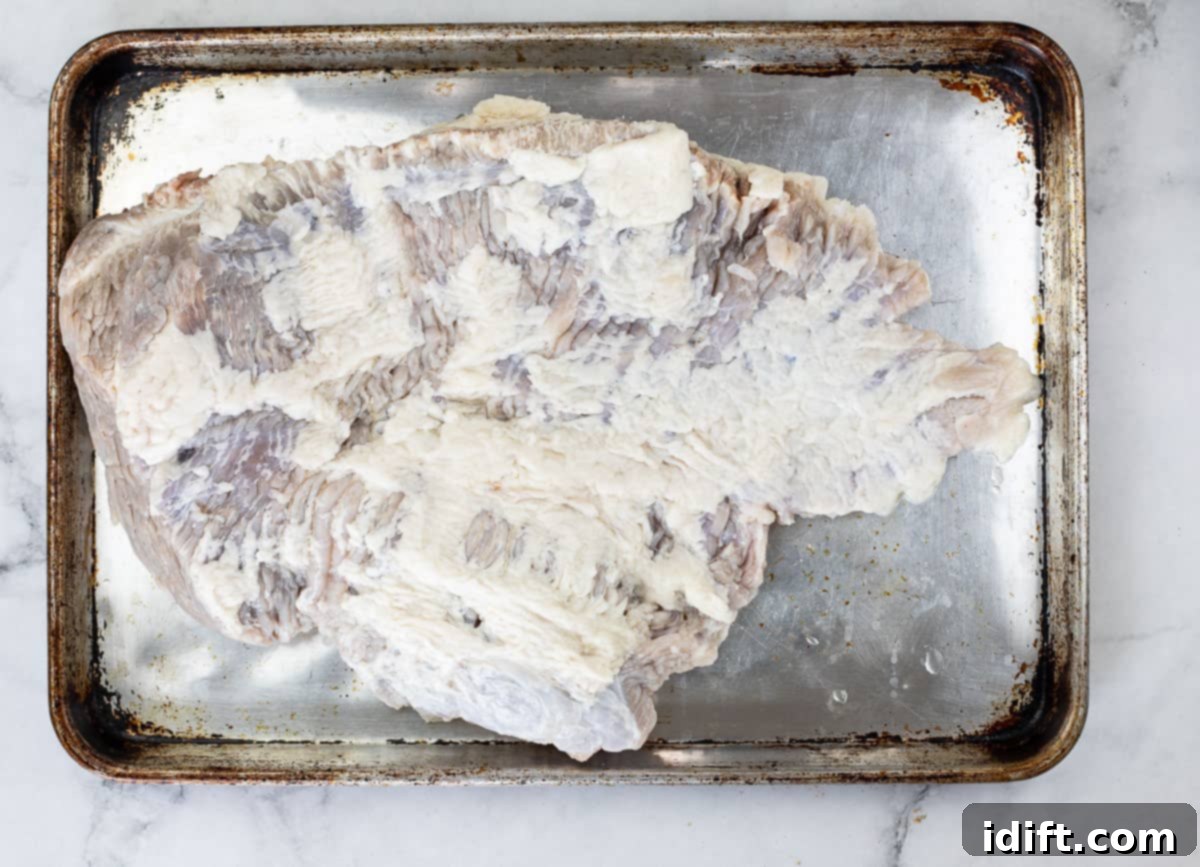 brisket after curing for 5 days, showing a light pink color