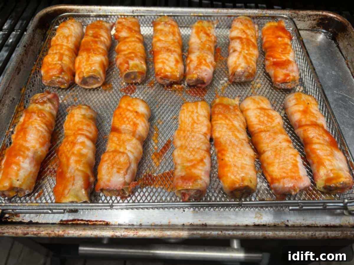 Sauced shotgun shells ready for the last smoke, glistening with BBQ sauce.