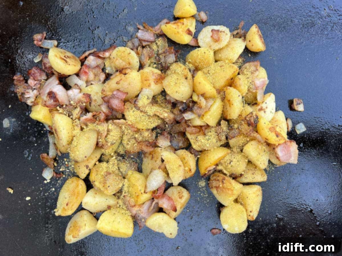 fry the potatoes, season, and combine with onions and bacon