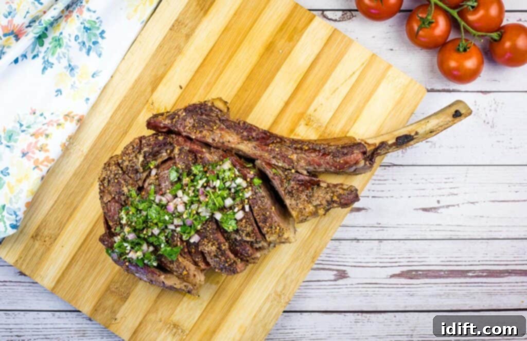 smoked tomahawk steak on a cutting board