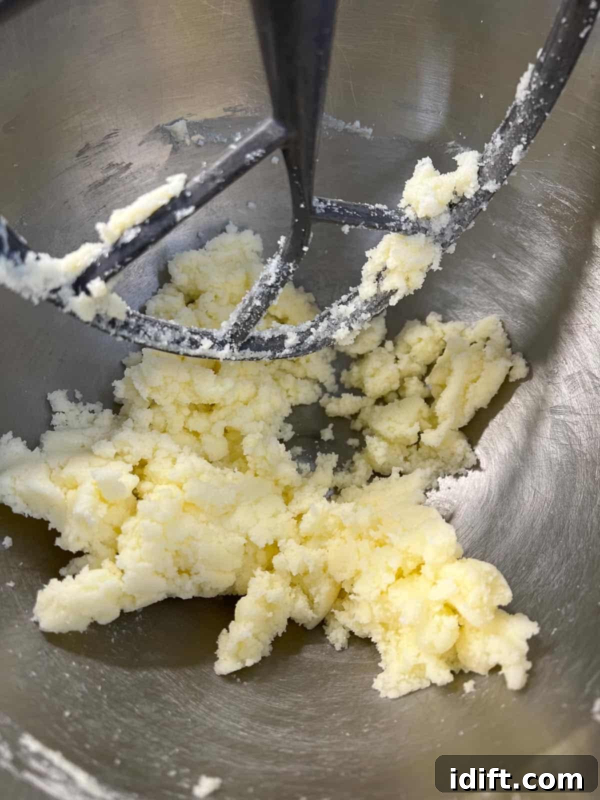 Creaming butter and sugar together in a stand mixer.