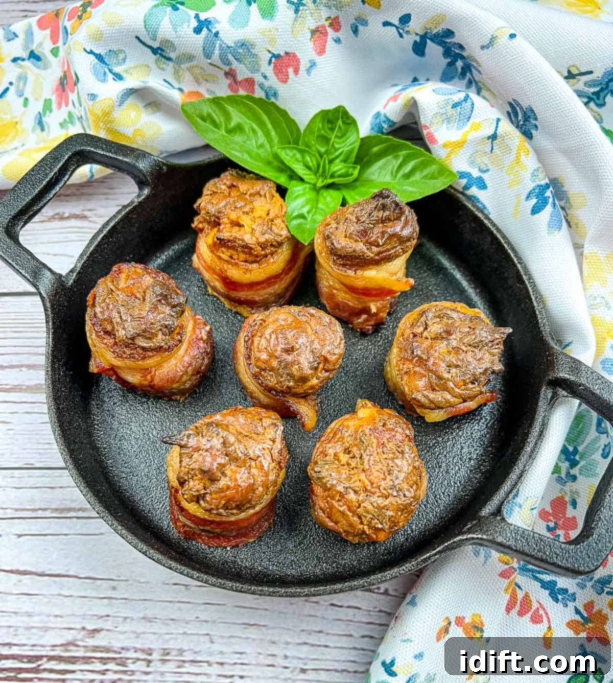 smoked pork shots on a black cast iron dish, garnished and ready to serve