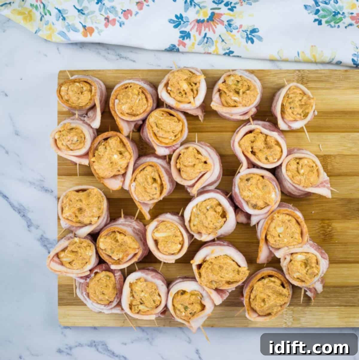 Filled pork shots ready for the smoker, arranged on a rack
