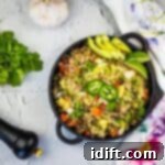 Brisket Fried Rice in a black serving bowl, garnished with fresh herbs.