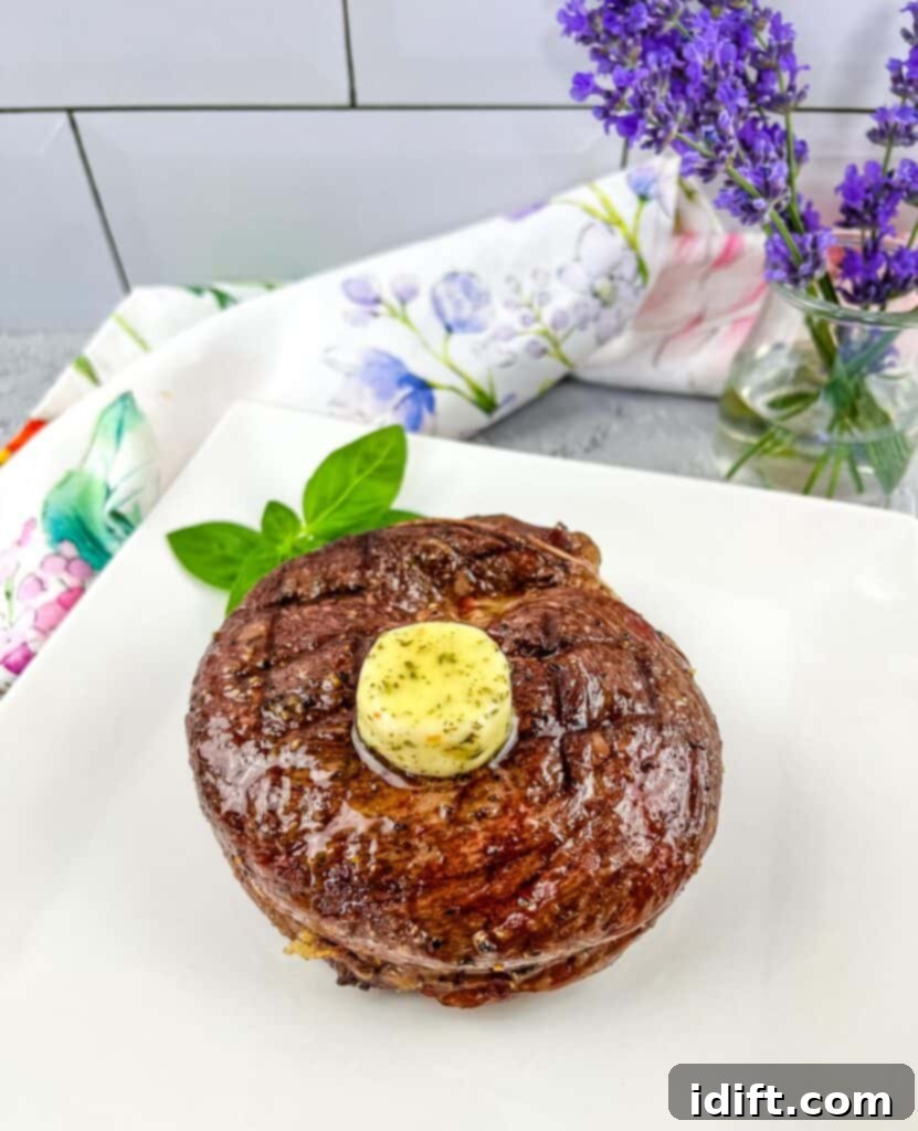 grilled cap steak topped with butter