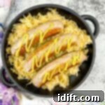 cooked sausage on a blackstone served on top of sauerkraut