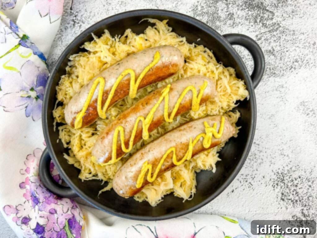 Cooked sausage served on top of sauerkraut from a Blackstone griddle
