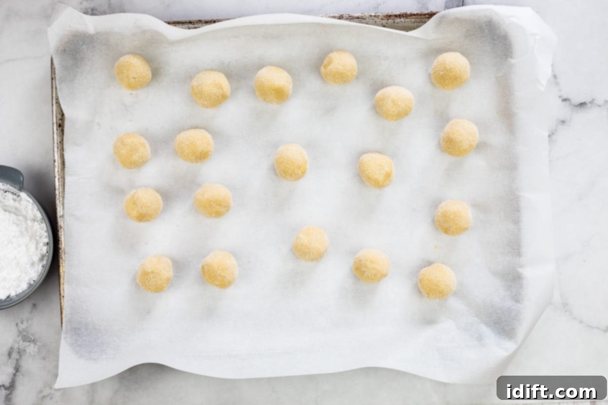 white chocolate crinkle cookie dough balls rolled in sugar