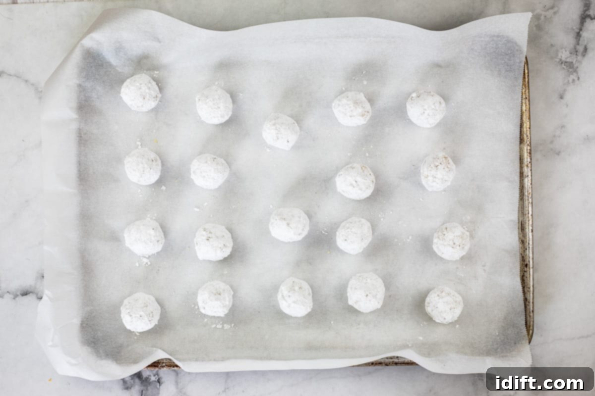 white chocolate crinkle dough balls rolled in powdered sugar