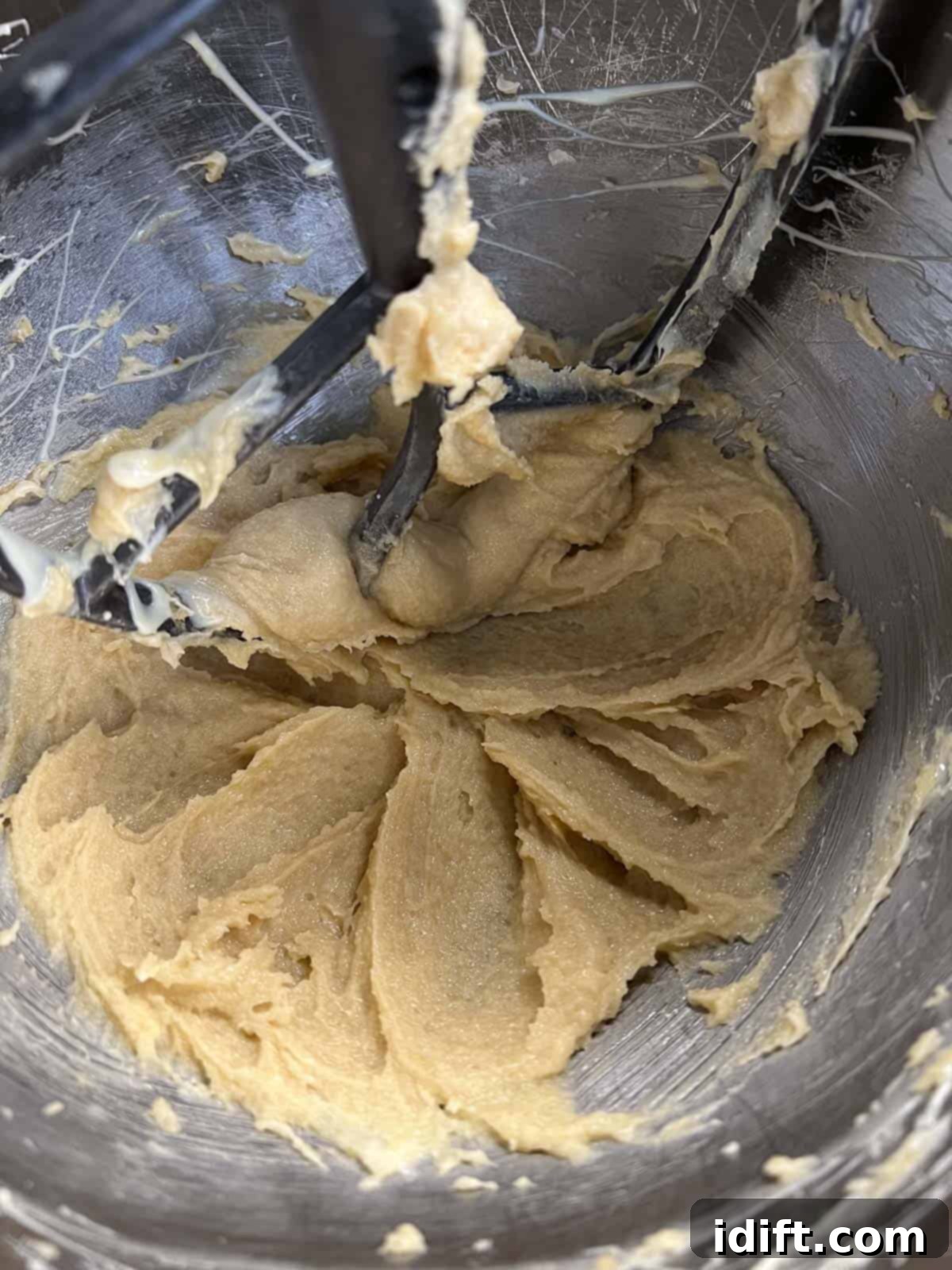 drizzle white chocolate into butter sugar mixture