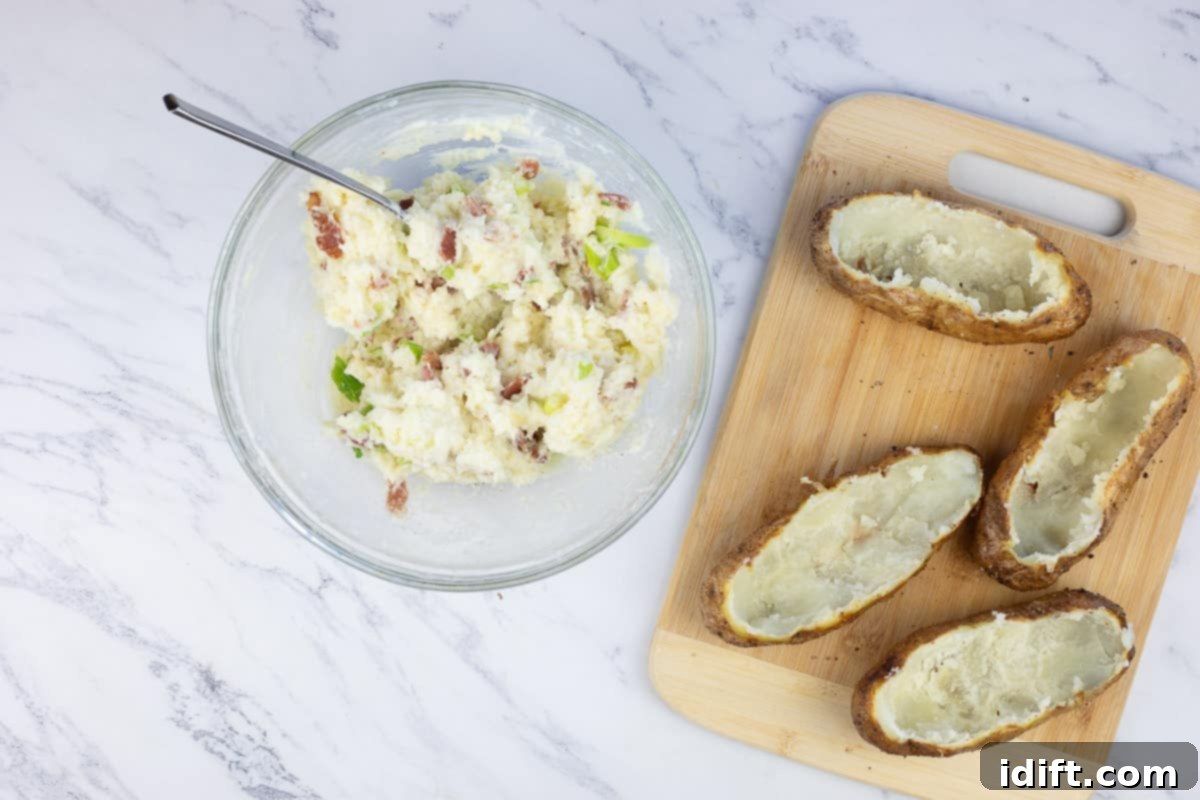 scooped potatoes with the mashed filling in a bowl