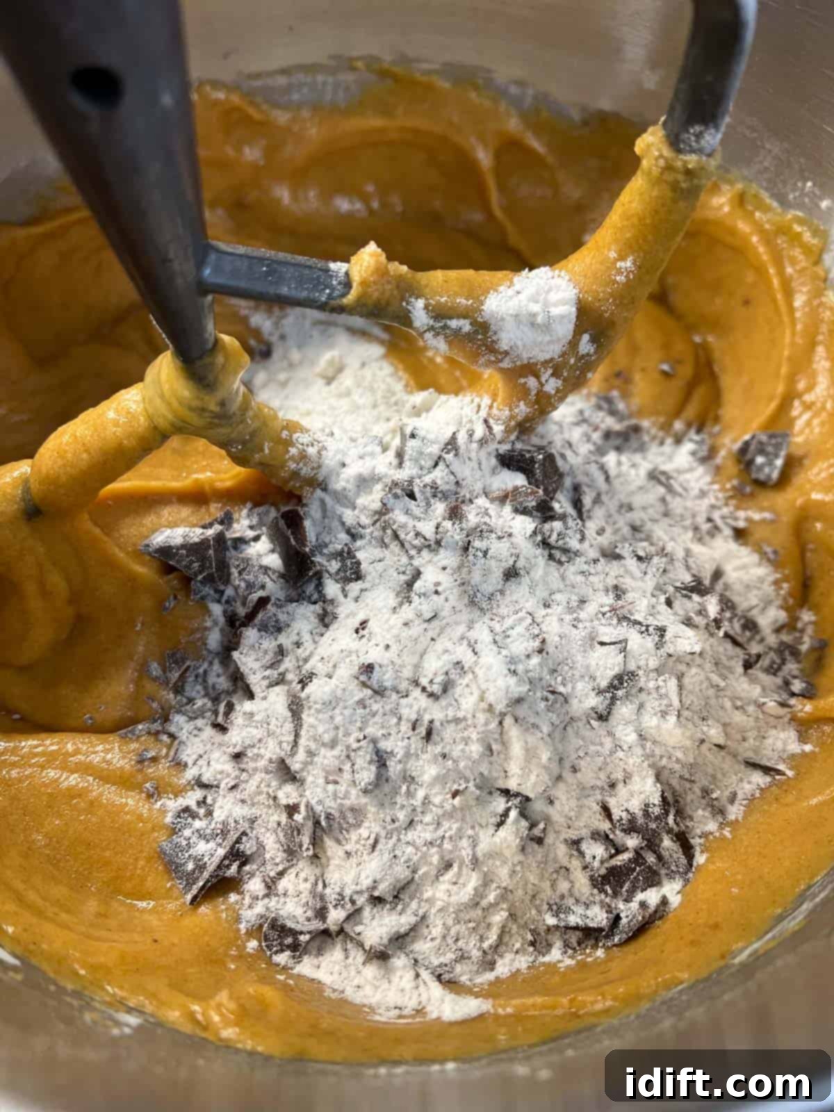Spiced Chocolate Pumpkin Dream 8 Adding flour-coated chocolate chunks to the cake batter