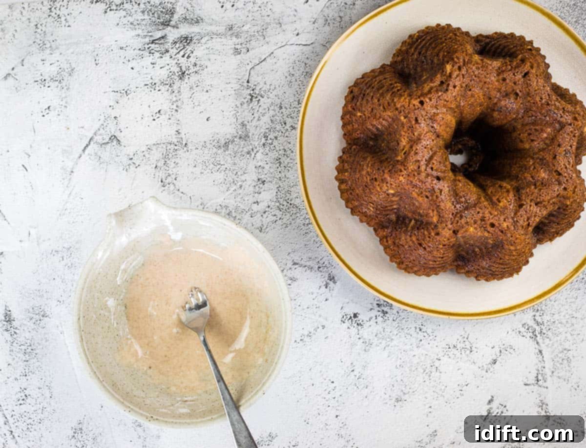 Spiced Chocolate Pumpkin Dream 10 Applying glaze to a cooled pumpkin chocolate cake