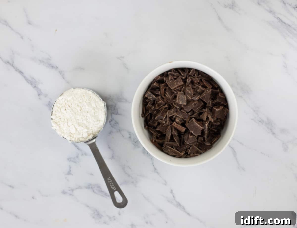 Spiced Chocolate Pumpkin Dream 7 Chocolate chunks mixed with a small amount of flour in a bowl