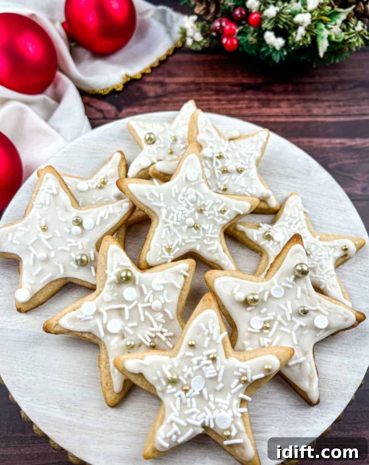 eggnog sugar cookies on a white platter, beautifully decorated for the holidays