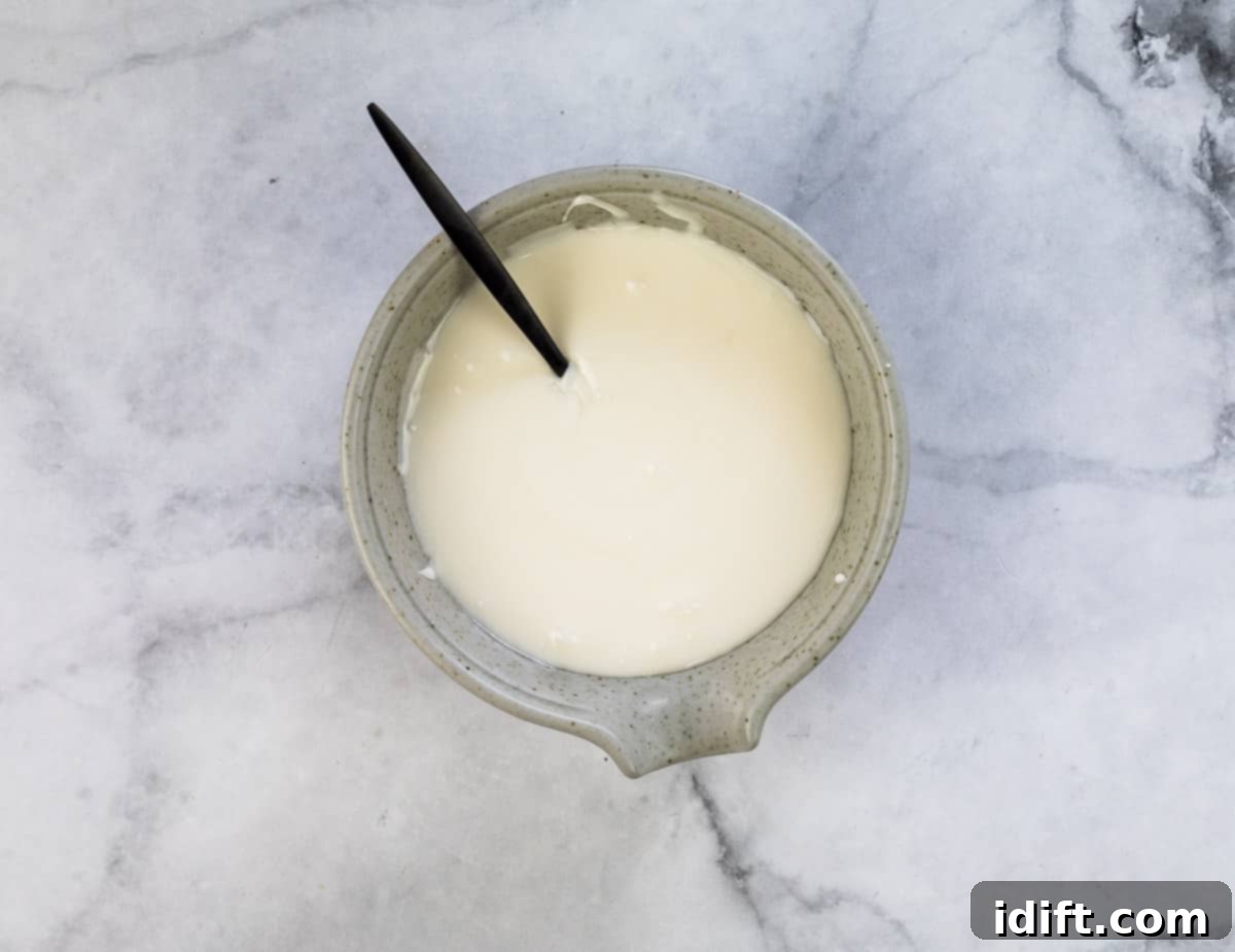 mixed royal icing in a small bowl, smooth and ready to use