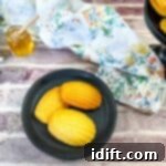 honey butter cornbread madeleines on a black plate