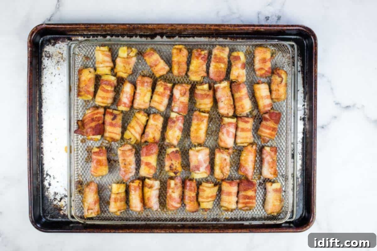 Smoked bullets, having achieved a beautiful color, awaiting the final barbecue sauce glaze.