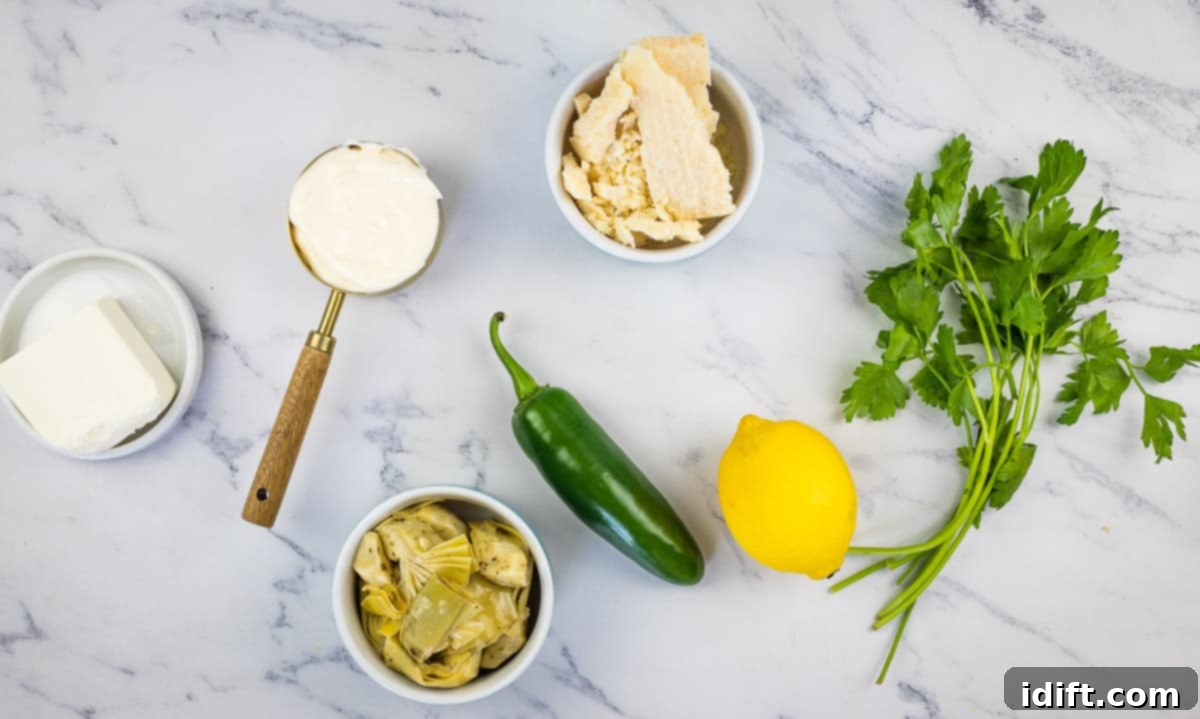 Creamy Jalapeno Artichoke Dream 5 Ingredients for making artichoke Jalapeno dip: artichoke hearts, Parmesan, cream cheese, mayo, parsley, lemon, and jalapenos.