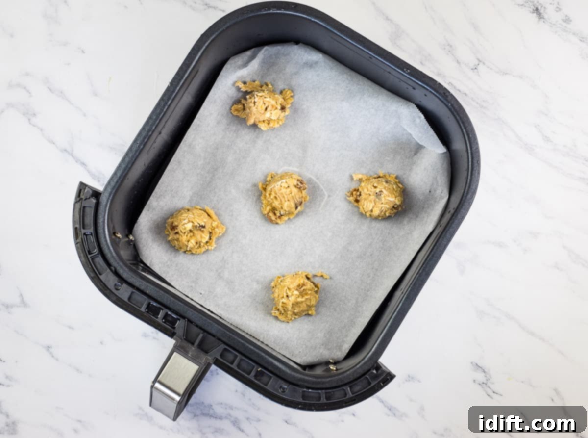 Cookies scooped and in air fryer basket.
