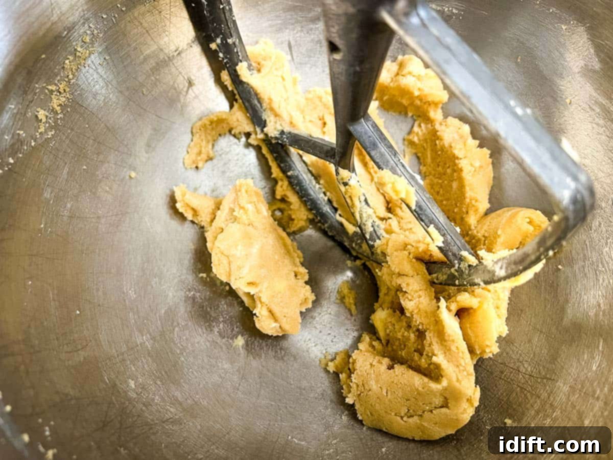 Butter and sugars creamed in a bowl.