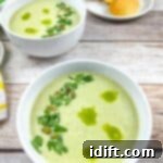 Jalapeno Velvet Warmth 12 Two bowls of Cream of Jalapeno Soup with cornbread madeleines in the background.