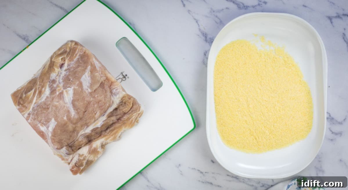 Cured peameal bacon next to a plate of cornmeal