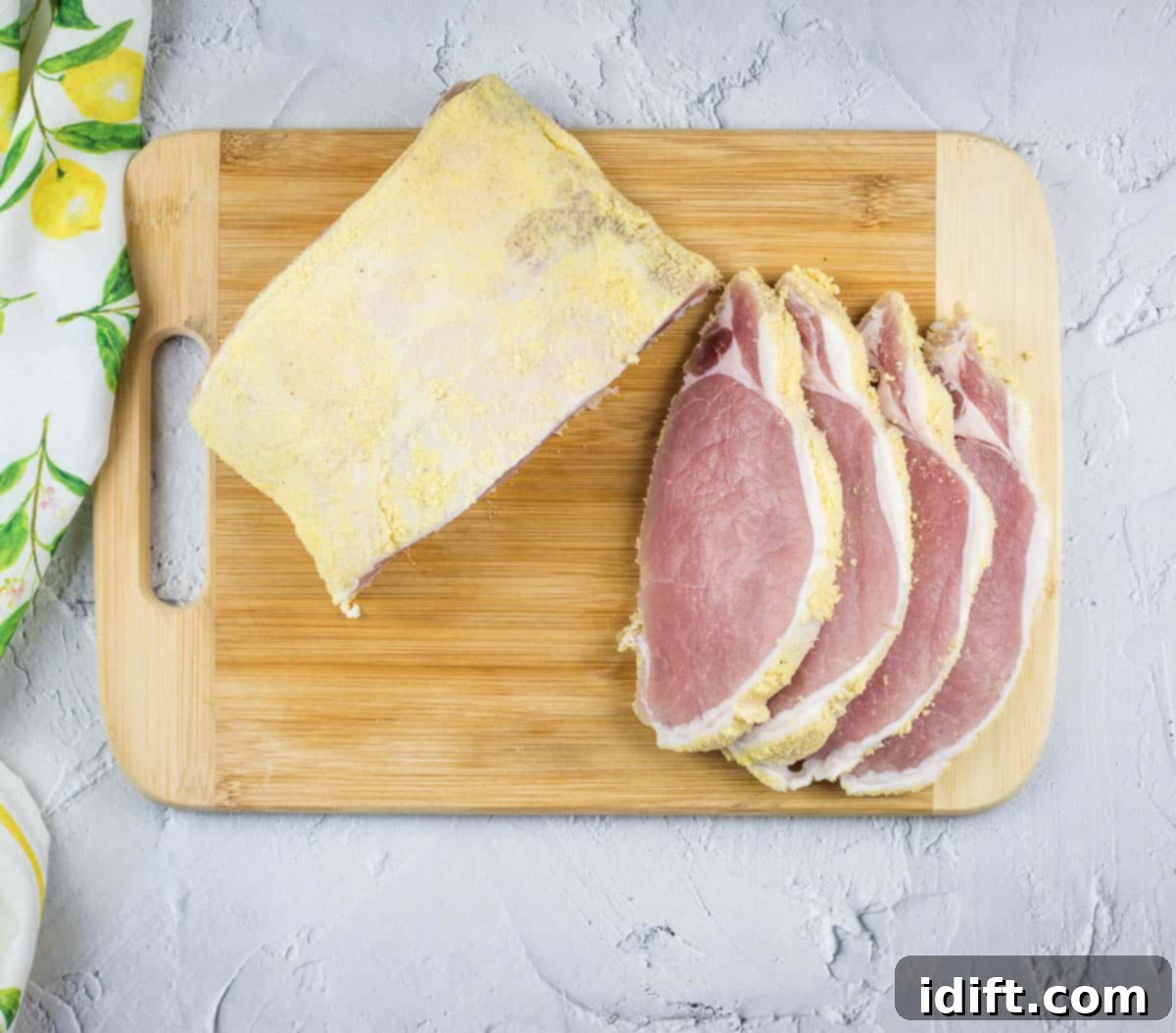 Sliced peameal bacon on a cutting board.