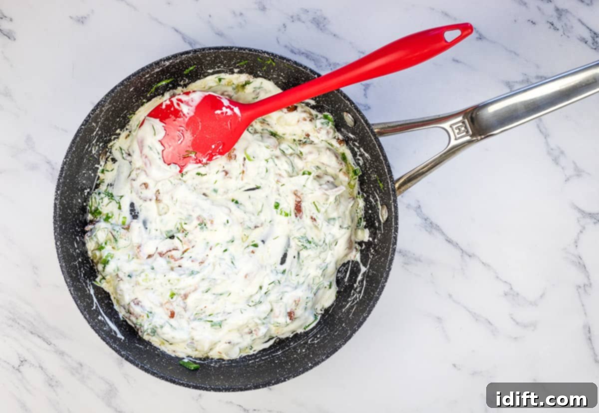 Sour cream mixed with bacon, green onions, and dill.