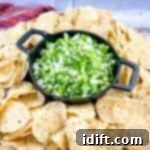 Tomatillo Pico de Gallo on a plate with tortilla chips.