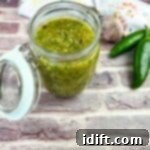 Tomatillo Sauce in a glass jar.