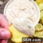 Cajun Kick Sauce 7 Cajun dip on a potato chip.