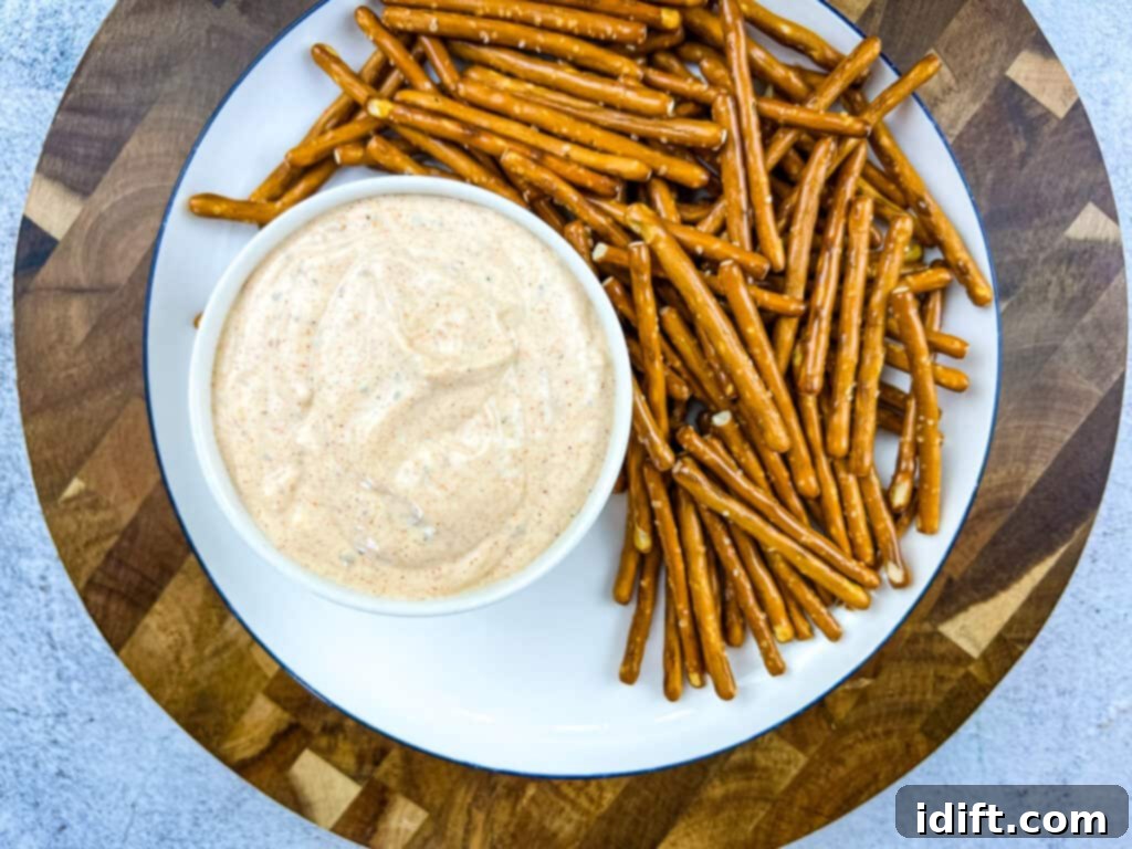 Cajun Kick Sauce 6 Cajun dip in a bowl with pretzels.
