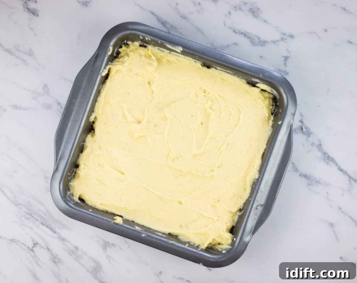 Batter poured over the top of the berries.