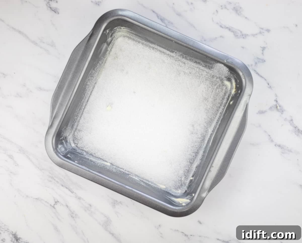 The baking dish buttered and sprinkled with sugar.