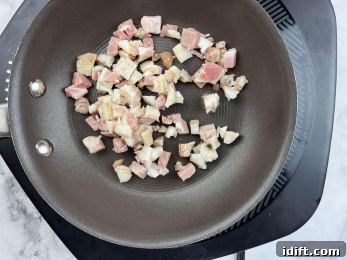 Sweet Caramelized Onion and Umami Mushroom Soup 11 Strips of bacon sizzling and crisping in a separate hot skillet, preparing the perfect crunchy topping.
