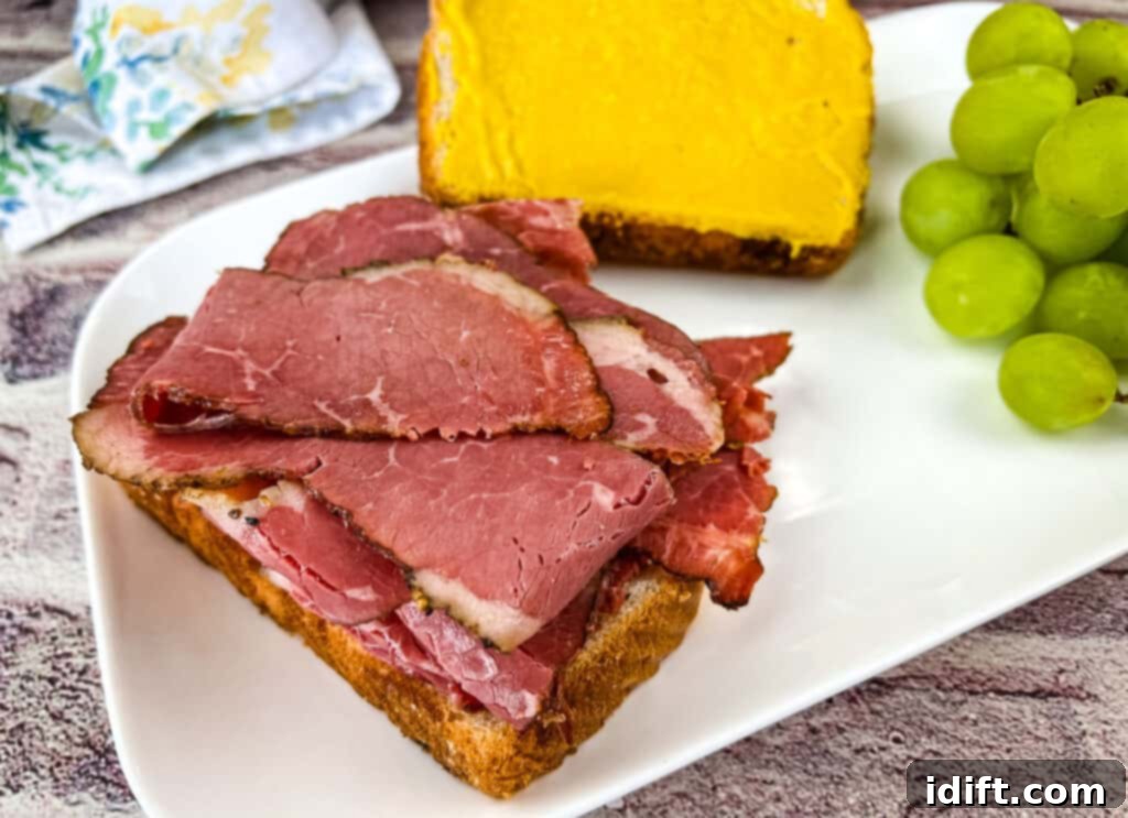 Crafting Montreal Smoked Meat at Home 3 A classic Montreal Smoked Meat sandwich, with layers of thinly sliced meat, mustard, and rye bread.