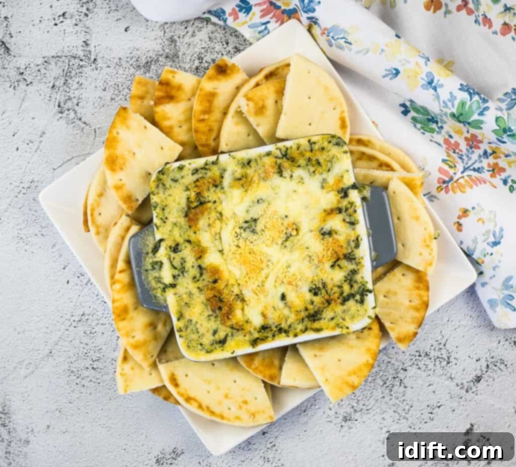 A top-down shot of Spinach and Brie Dip in a serving dish.