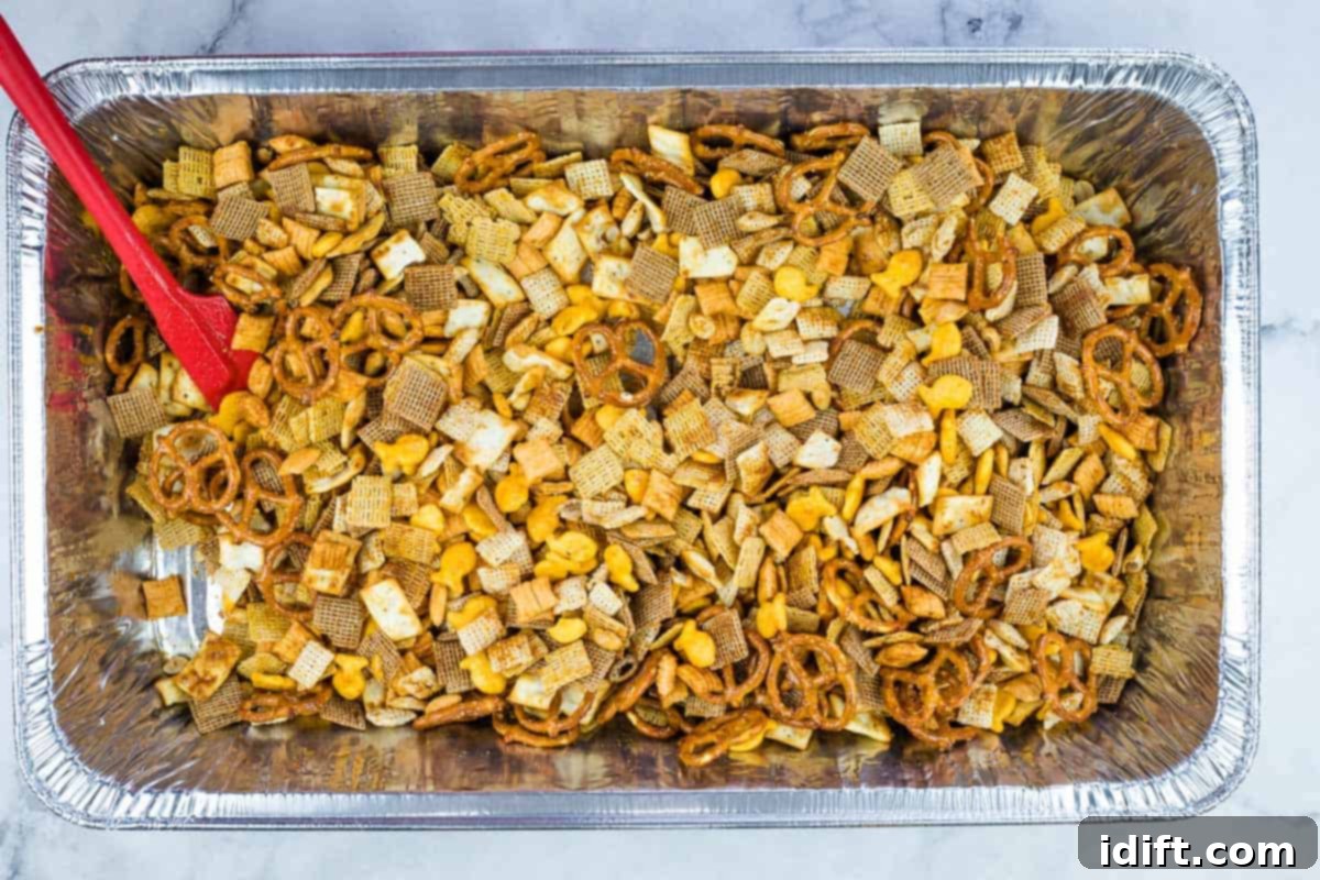 Chex mix tossed with butter mixture.