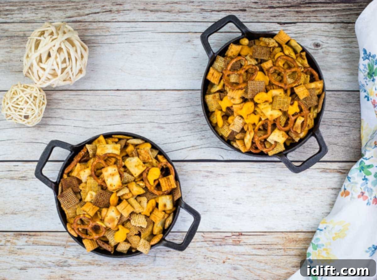 Smoked Chex Mix in two black dishes.