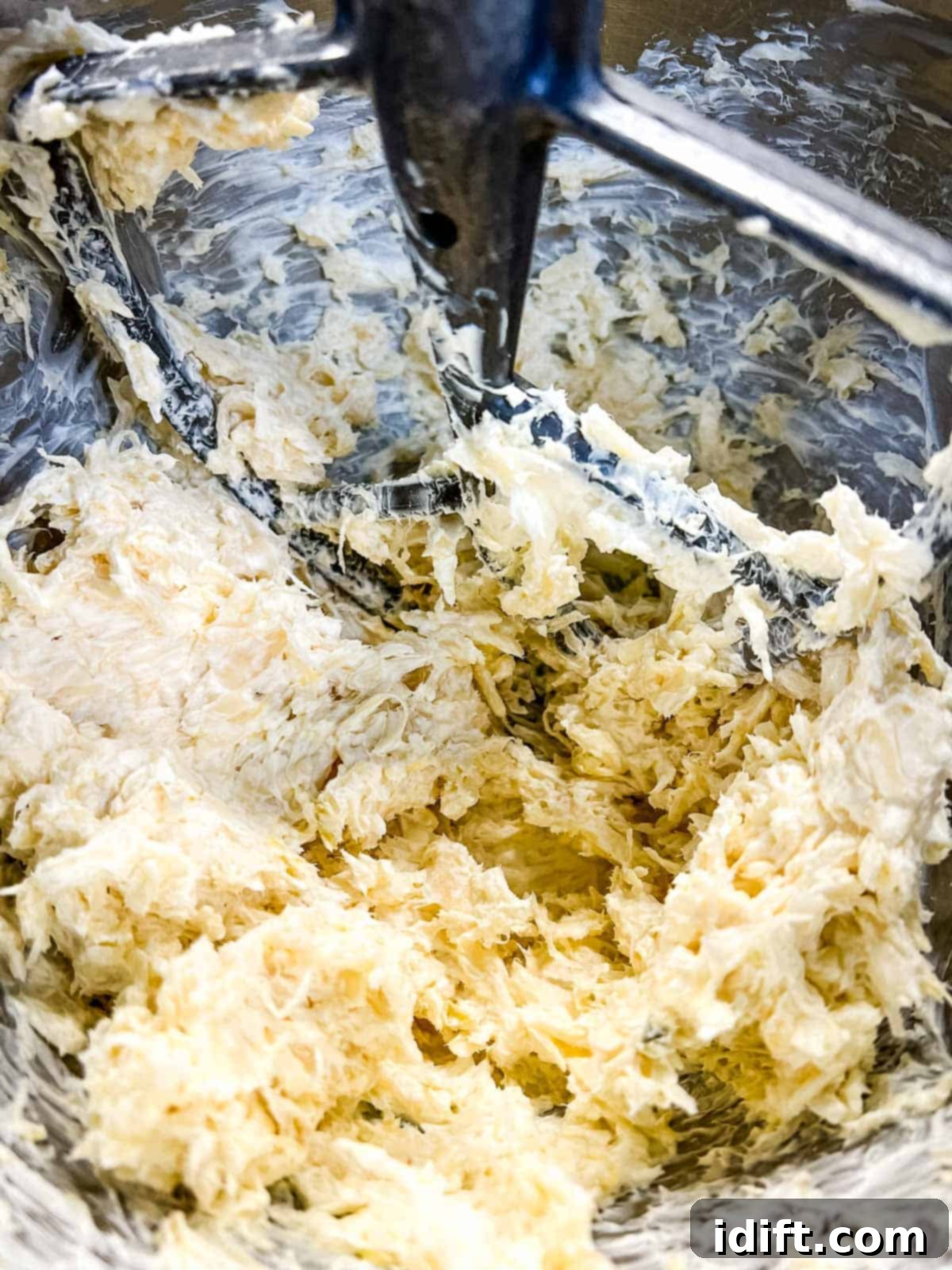 Savory Kraut Poppers 10 Sauerkraut mixed in with the cheese in a bowl.